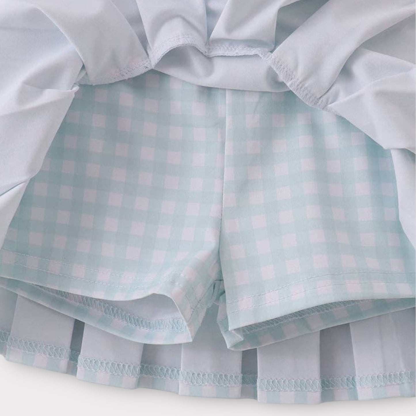 Blue gingham skort with built-in shorts underneath, showing comfortable lining for active girls