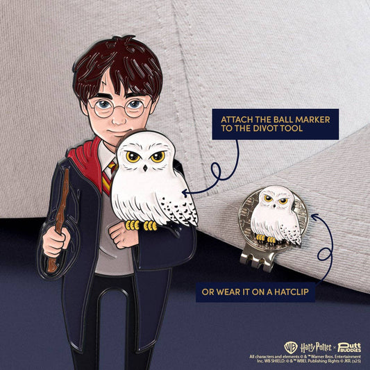 Harry Potter divot tool with Hedwig ball marker magnetically attached, shown clipped to golf hat brim
