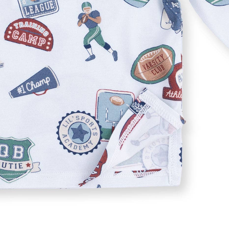 Children's clothing with football themed graphics and text on a white background