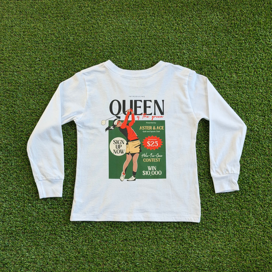 Back of a girls’ long sleeve white golf t-shirt featuring a vintage-style “Queen of the Green” graphic with a female golfer in red and tan swinging a club, set against a green background with retro text details.