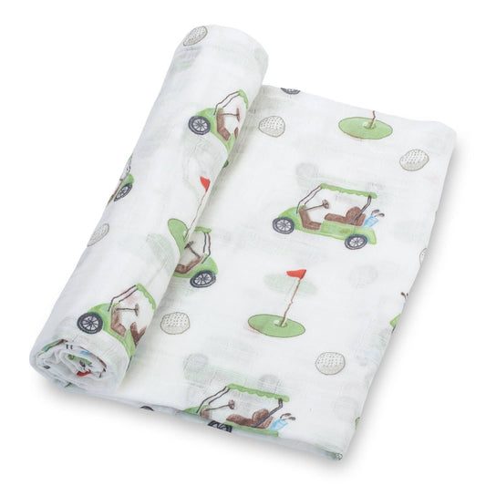 Golf-themed muslin baby blanket with green golf carts, flags, and golf balls on soft white cotton fabric, lightweight and breathable for babies and toddlers.