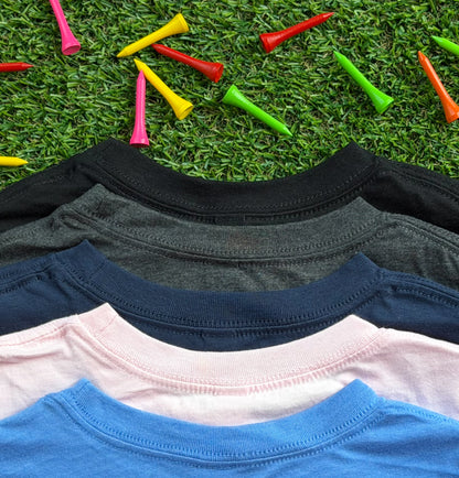 Close-up of the necklines of Royal-Tee long sleeve golf shirts in heather Columbia blue, pink, navy, heather charcoal, and black, displayed on green turf with colorful golf tees scattered around.