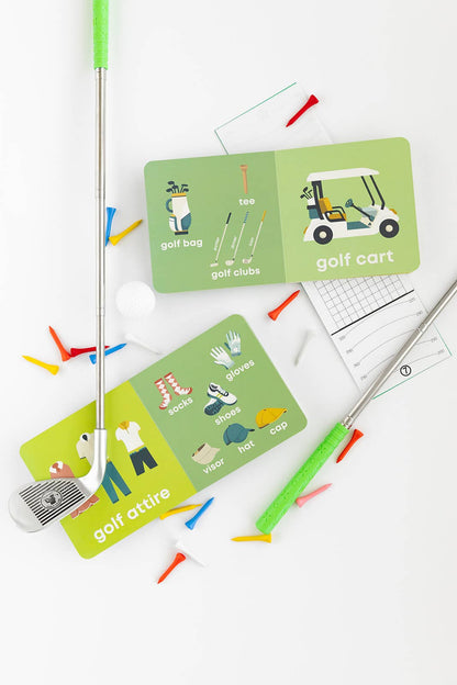 Golf book opened so that you can see some of the pages. Pages include images of golf carts, golf clubs, golf attire, and a golf bag with the names of each item written underneath.