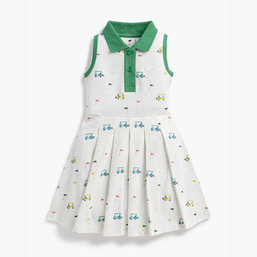 White dress with green collar and colorful golf pattern on a white background