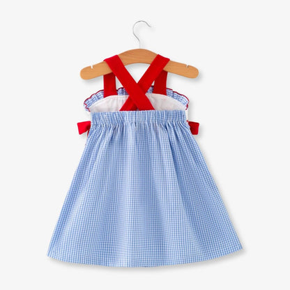 Back view of toddler girls blue plaid baseball smocked dress with red crisscross straps