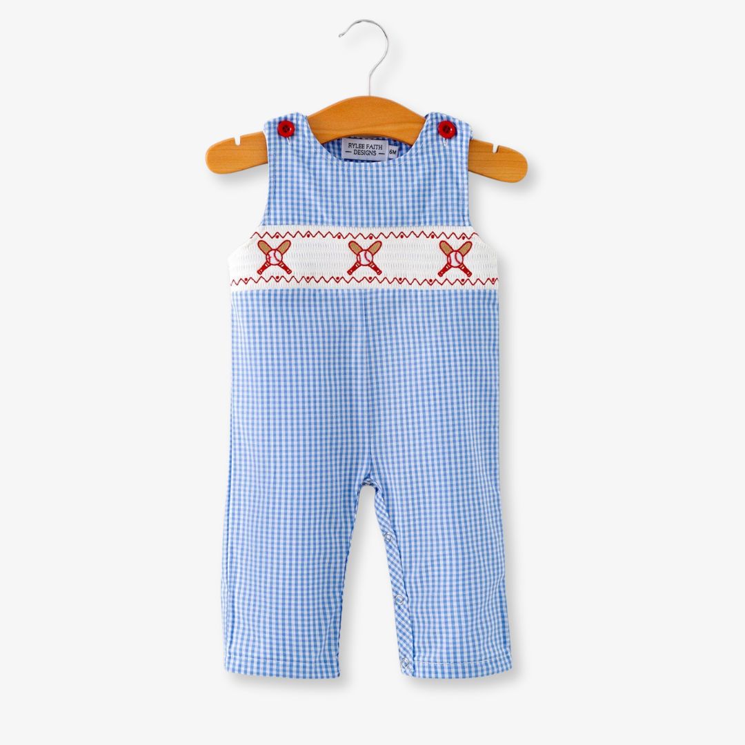 Full front view of blue plaid baby boy baseball smocked romper on hanger