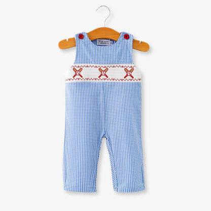 Full front view of blue plaid baby boy baseball smocked romper on hanger