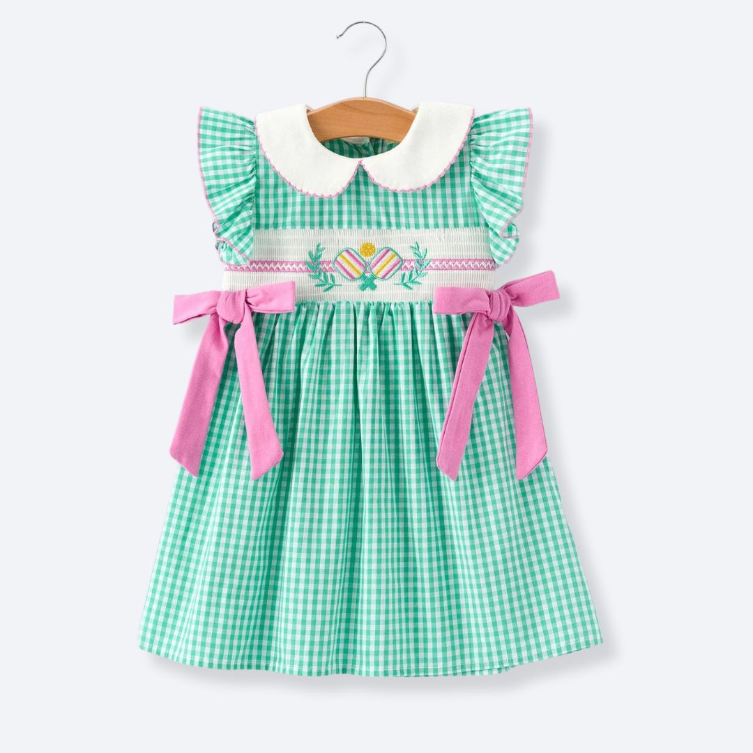 Girls green gingham pickleball smocked dress with pink bows front view