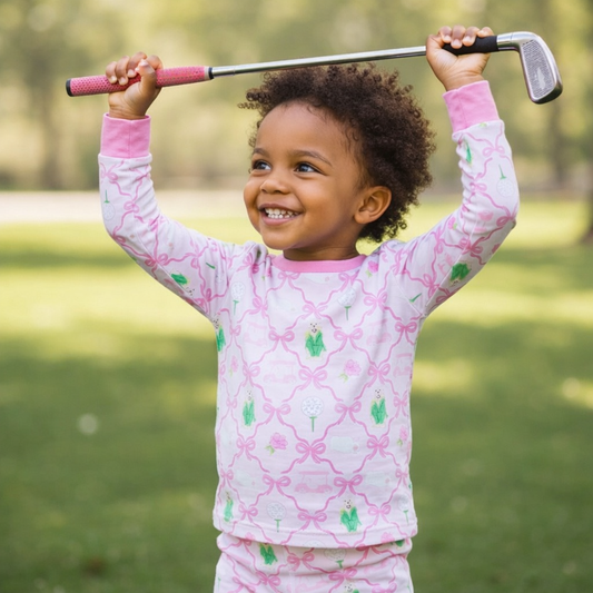 Child in pink and green Masters Golf inspired kids pajamas