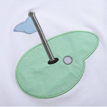 Toddler golf shirt close-up with embroidered golf hole and flag appliqué