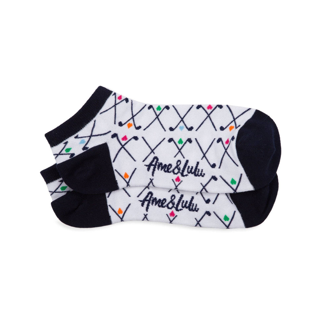 Folded pair of white athletic socks with navy heel and toe, multicolor golf club print and Ame & Lulu logo visible