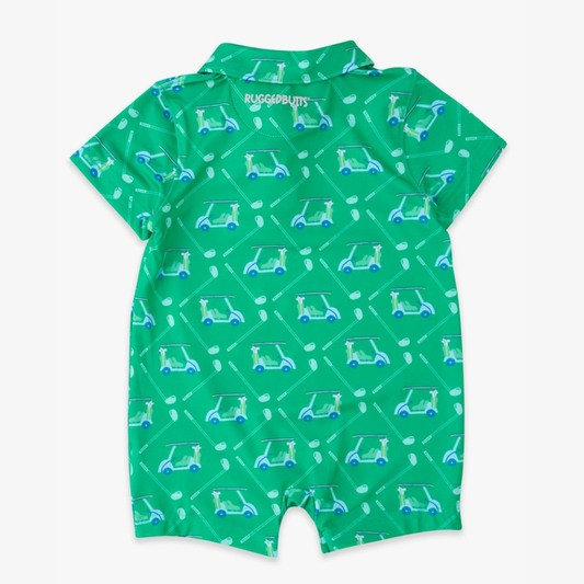 Back of bright green baby romper with cheerful golf carts alongside crisp white clubs, creating a pattern that’s full of motion and sporty charm.