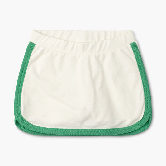 Monica + Andy organic cotton ivory sport skort with green contrast trim for toddlers and kids, featuring elastic waistband and built-in shorts