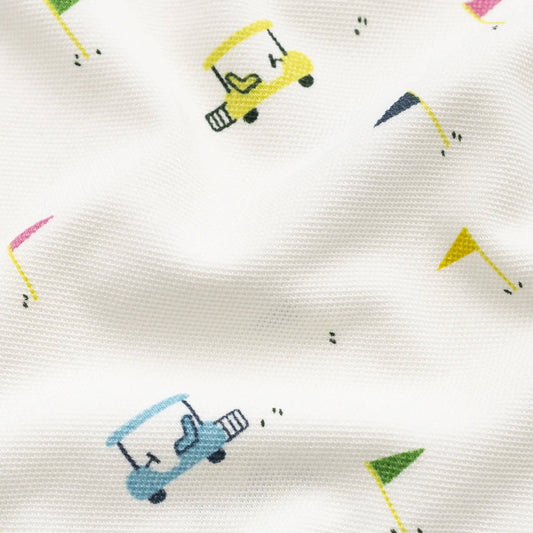 Pattern of colorful golf carts on a white fabric background