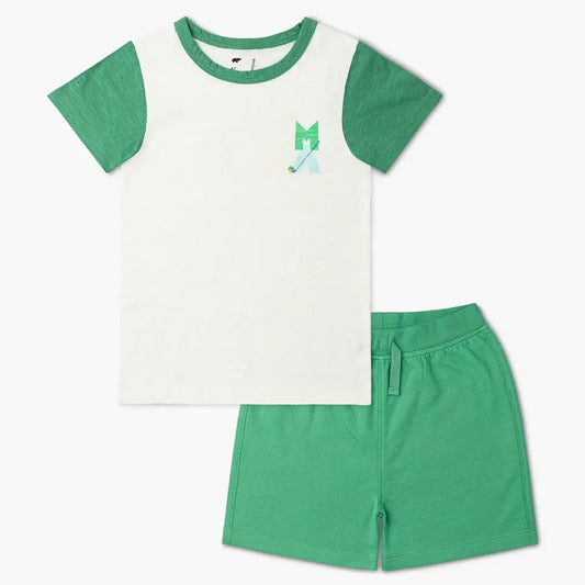 Childrens golf outfit with white and green tshirt and green shorts. golf club detail on left pocket area.
