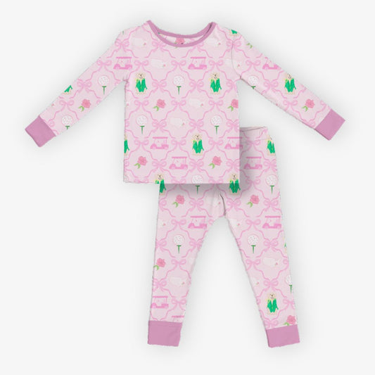 Pink kids pajama set with long sleeve top and matching pants featuring golf-inspired pattern
