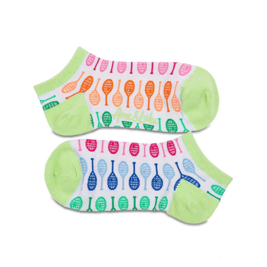 Pair of white ankle socks laid flat, featuring multicolor tennis racket graphics with pastel green heel and toe accents on a clean white background.